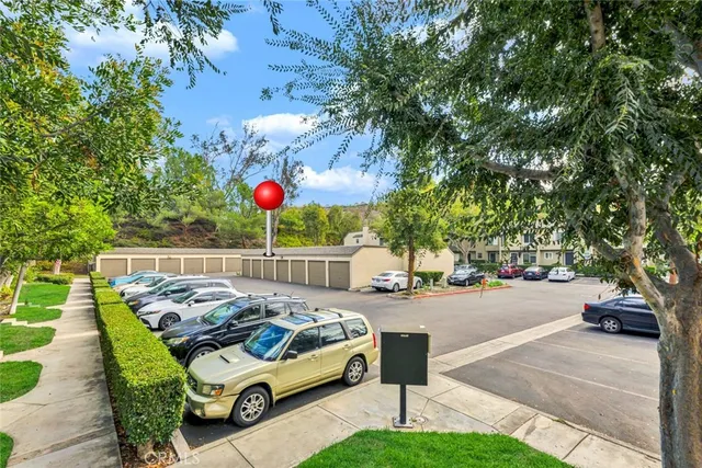 a view of a patio with a table and chairs under an umbrella
