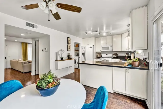 a kitchen with a table and chairs