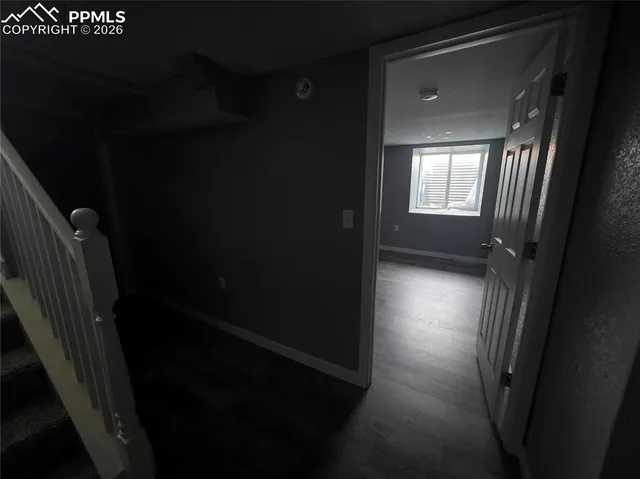 a view of hallway with shower and stairs