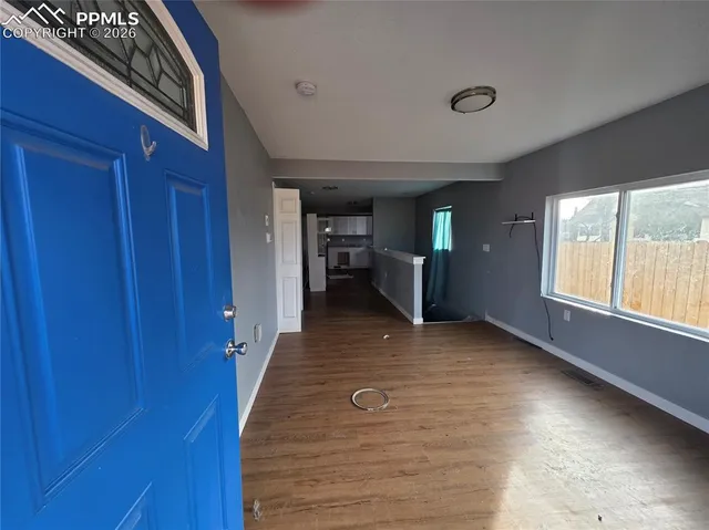 a view of a livingroom with furniture and window