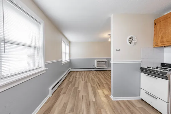 a view of kitchen and wooden floor