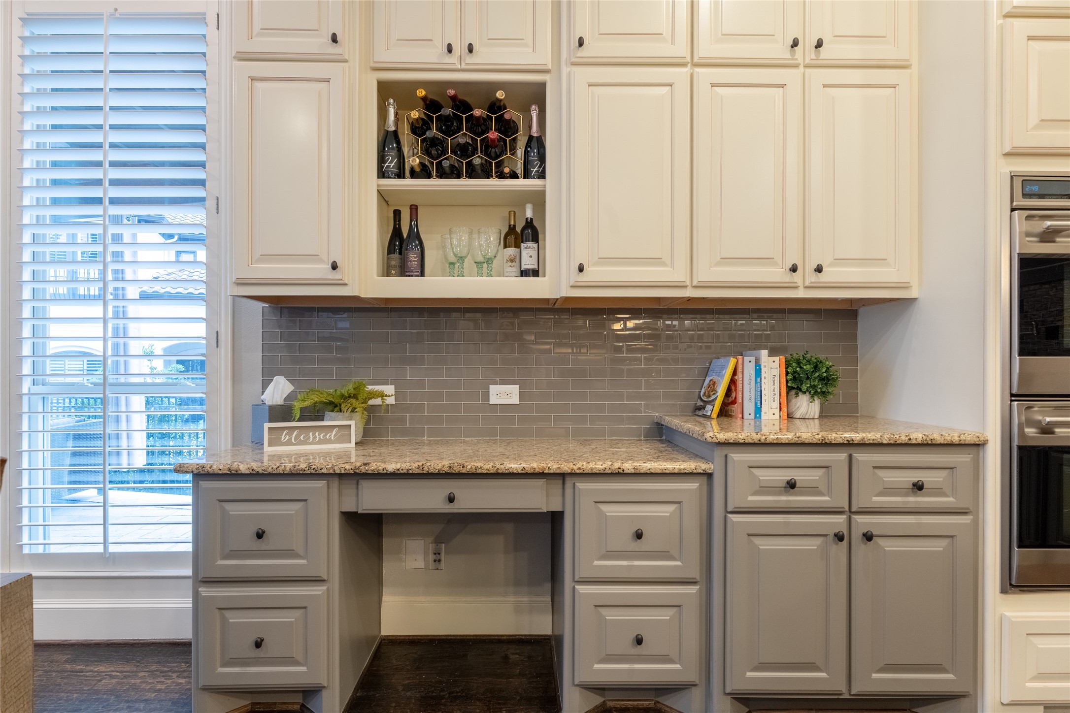 6 Rhapsody Bend Drive The Woodlands, TX 77382 - Photo 12 of 39 a kitchen with granite countertop white cabinets and white appliances