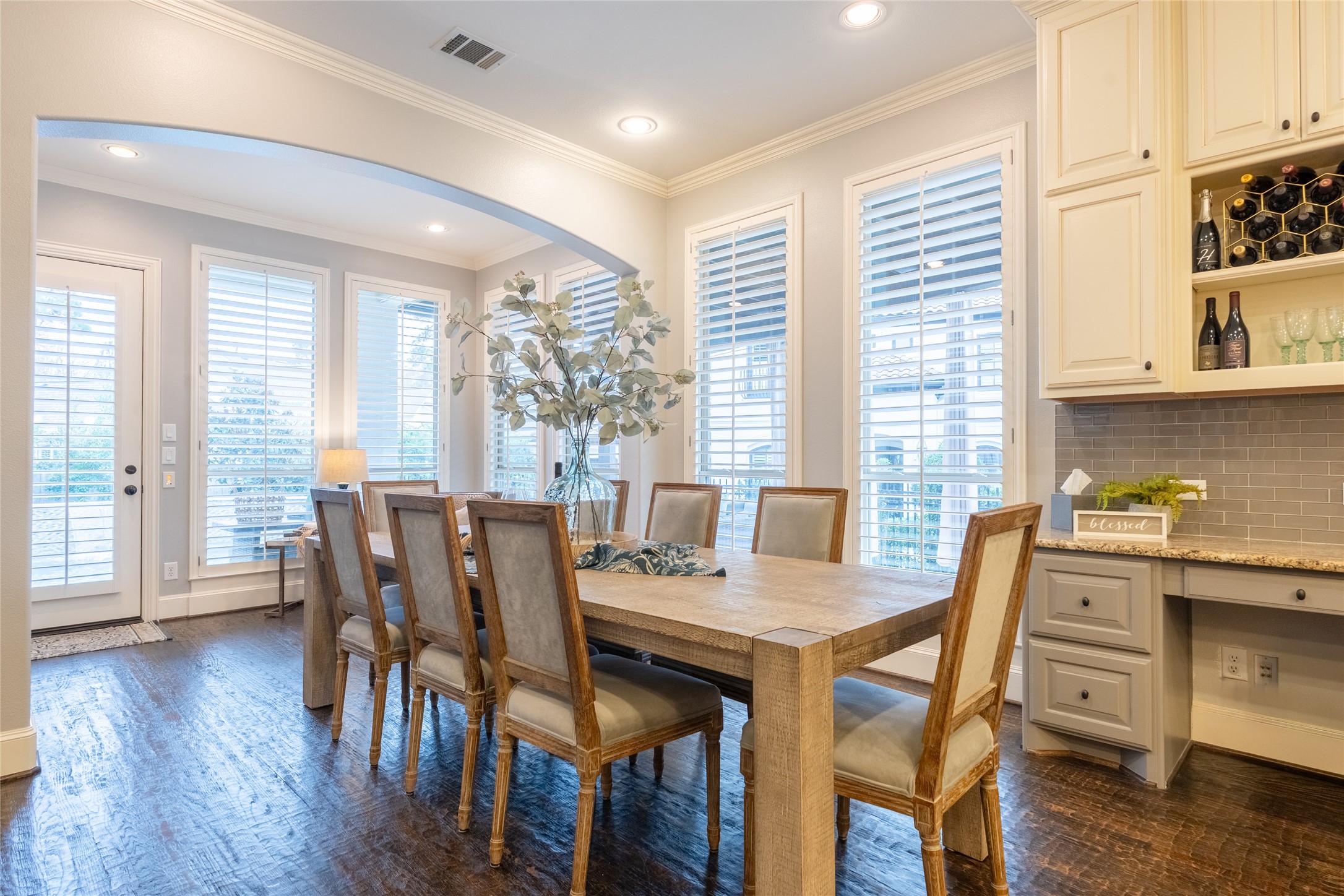 6 Rhapsody Bend Drive The Woodlands, TX 77382 - Photo 13 of 39 a view of a dining room with furniture and wooden floor
