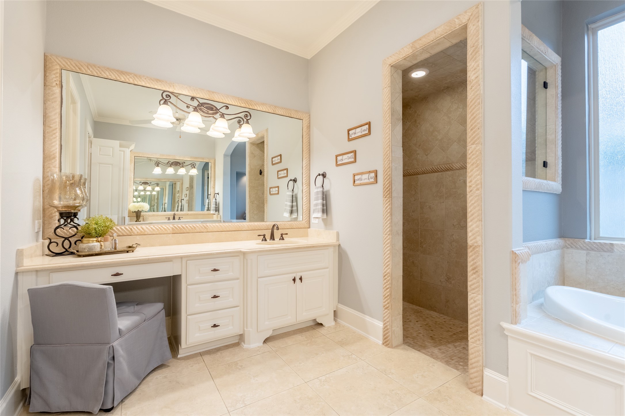 6 Rhapsody Bend Drive The Woodlands, TX 77382 - Photo 20 of 39 a spacious bathroom with a granite countertop sink and a mirror