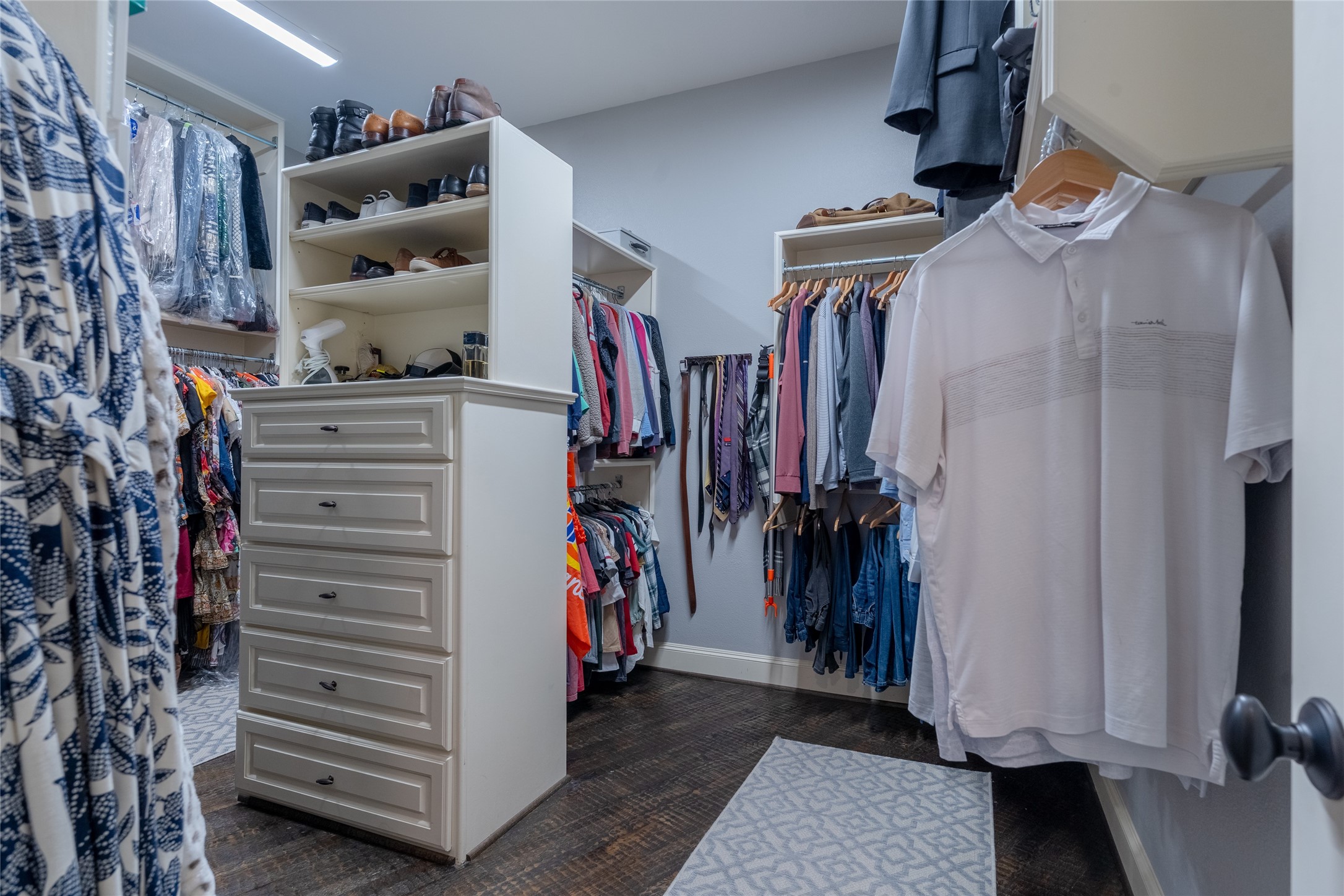 6 Rhapsody Bend Drive The Woodlands, TX 77382 - Photo 21 of 39 a view of walk in closet with clothes and shoes