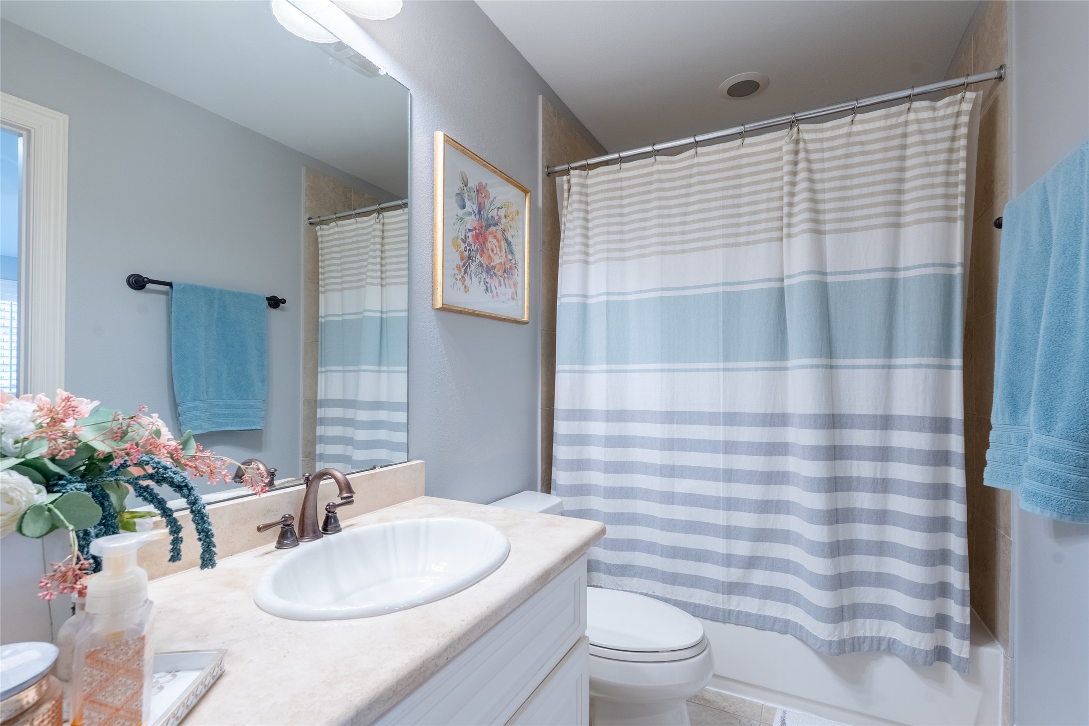 6 Rhapsody Bend Drive The Woodlands, TX 77382 - Photo 27 of 39 a bathroom with a sink a toilet and shower