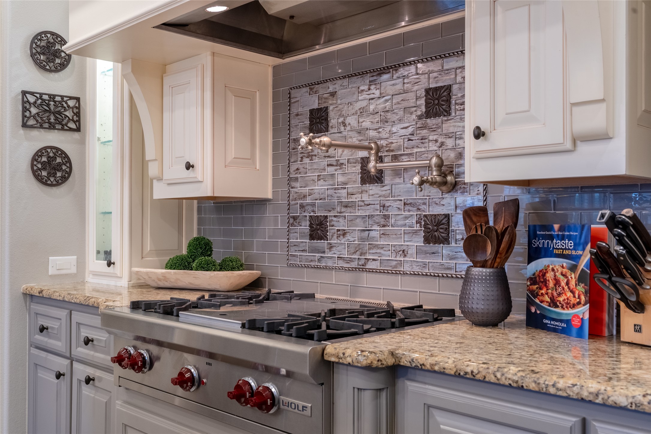 6 Rhapsody Bend Drive The Woodlands, TX 77382 - Photo 9 of 39 a kitchen with an oven a stove and cabinets