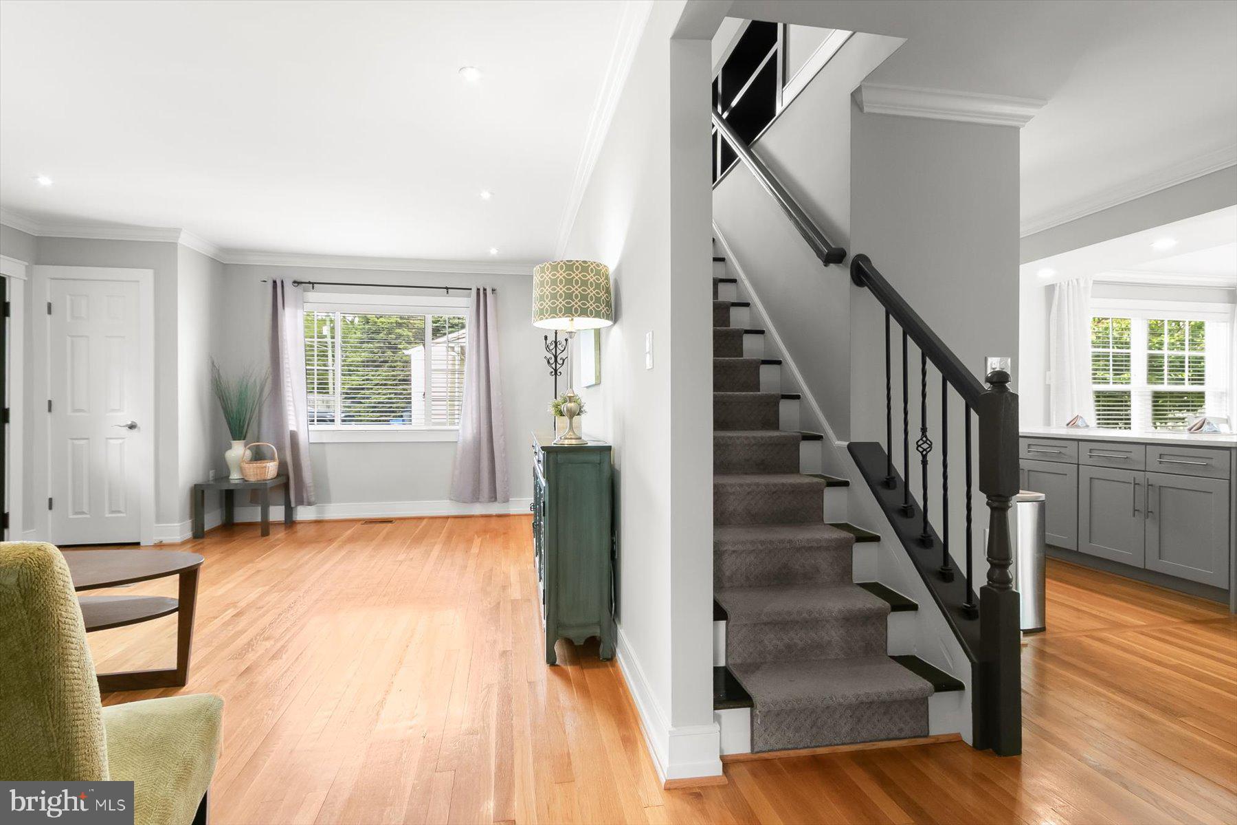 513 Gilmoure Drive Silver Spring, MD 20901 - Photo 11 of 60 a view of an empty room with wooden floor and stairs