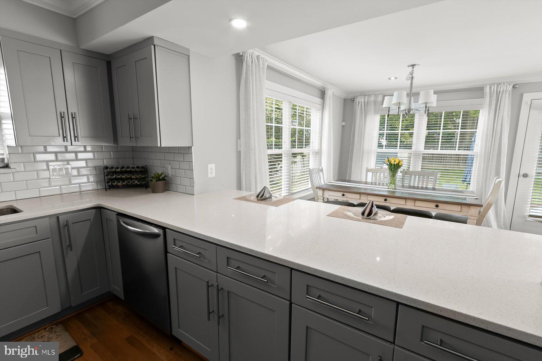 513 Gilmoure Drive Silver Spring, MD 20901 - Photo 18 of 60 a kitchen with a sink and large window