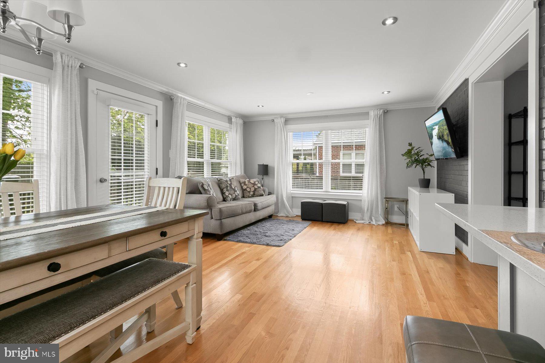 513 Gilmoure Drive Silver Spring, MD 20901 - Photo 20 of 60 a living room with furniture and a large window