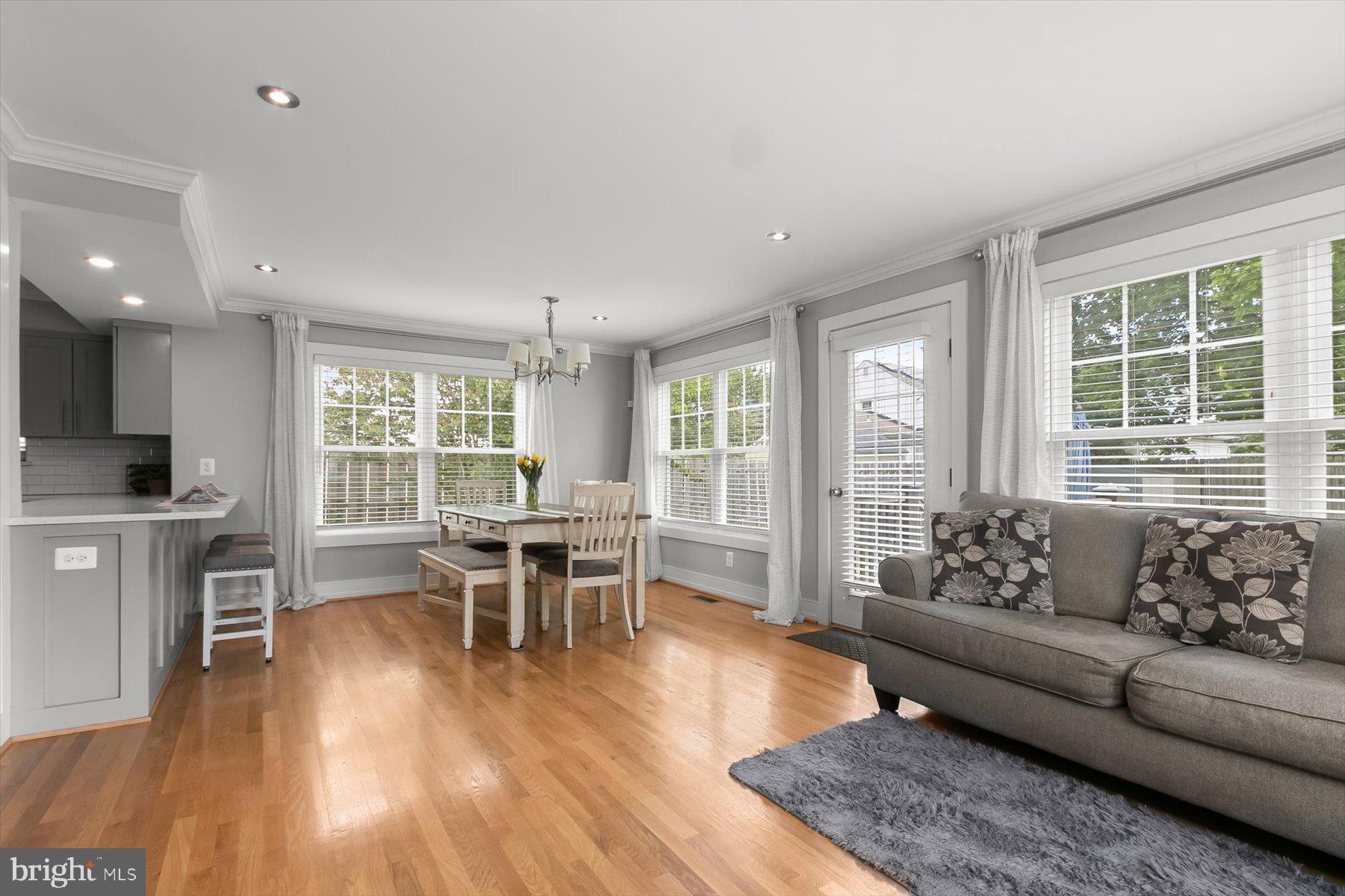 513 Gilmoure Drive Silver Spring, MD 20901 - Photo 22 of 60 a living room with furniture and a wooden floor