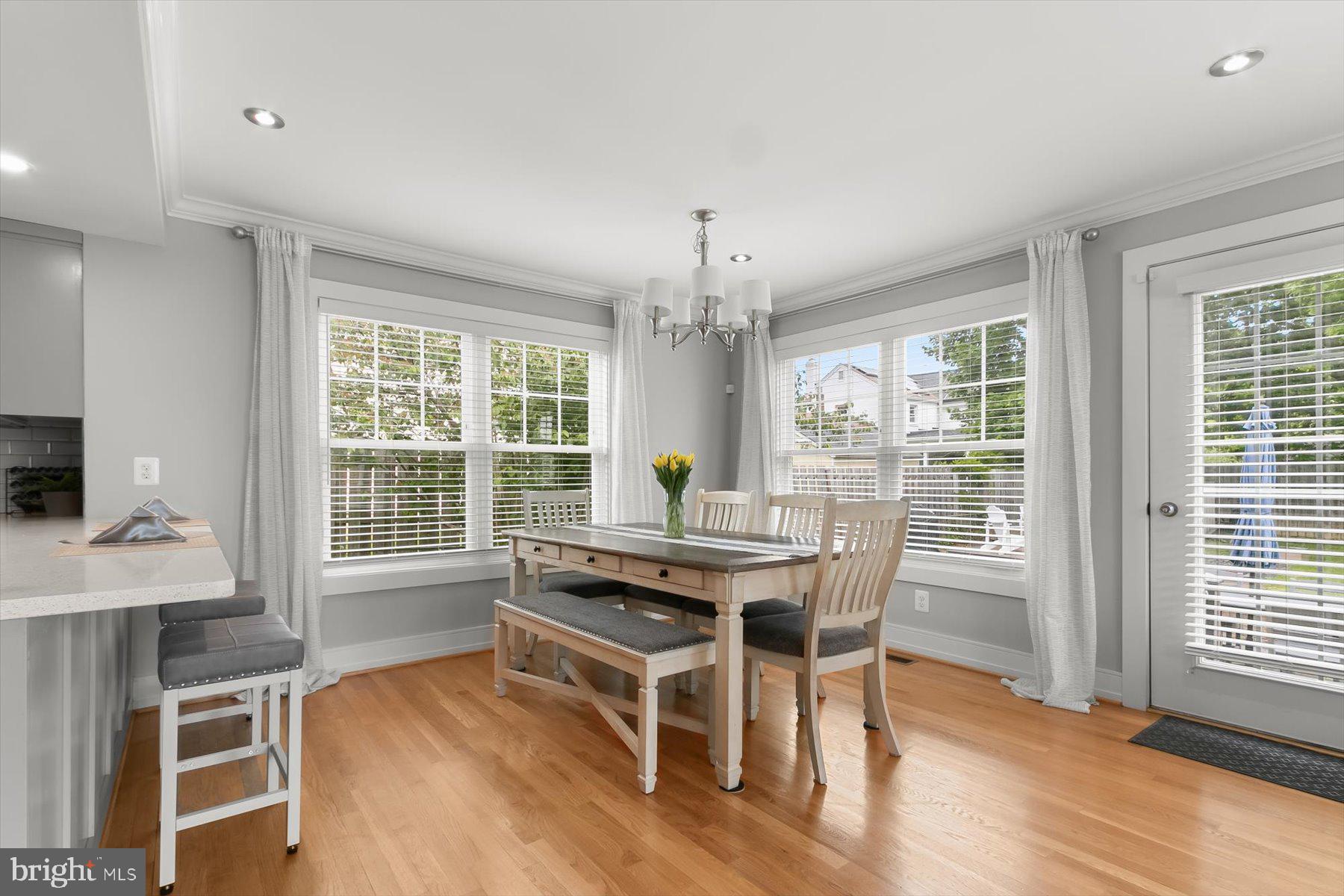 513 Gilmoure Drive Silver Spring, MD 20901 - Photo 25 of 60 a view of a dining room with furniture window and wooden floor