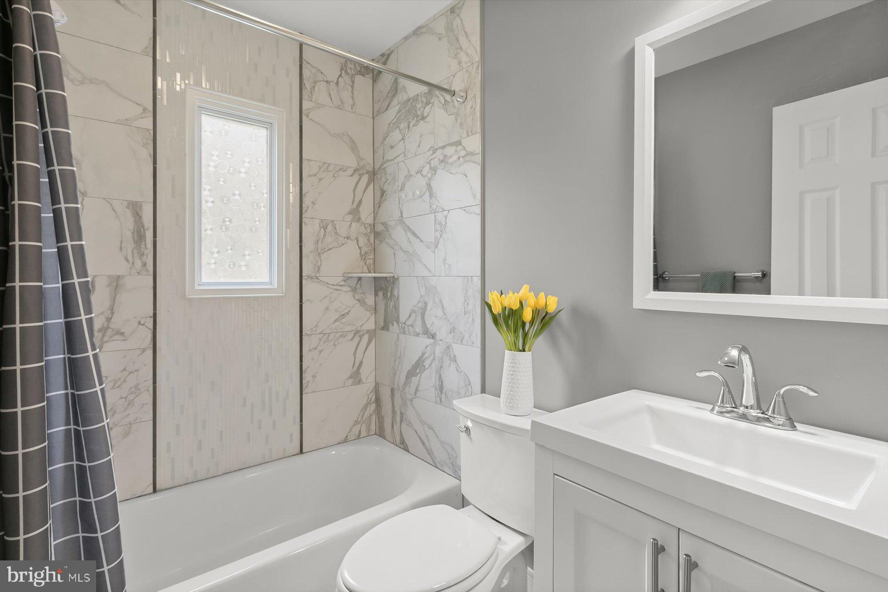513 Gilmoure Drive Silver Spring, MD 20901 - Photo 28 of 60 a bathroom with a sink toilet and shower