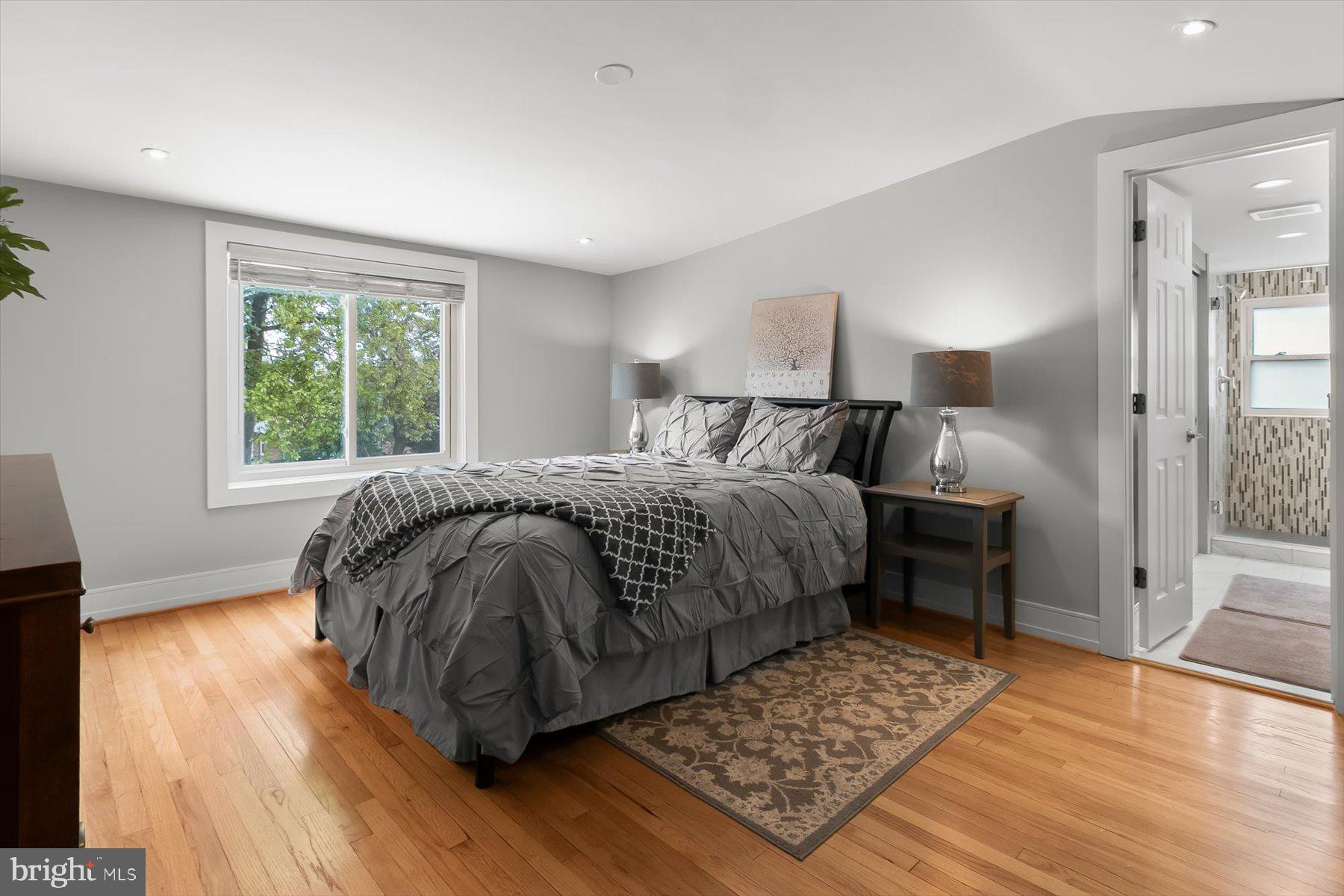 513 Gilmoure Drive Silver Spring, MD 20901 - Photo 35 of 60 a bedroom with a bed and wooden floor