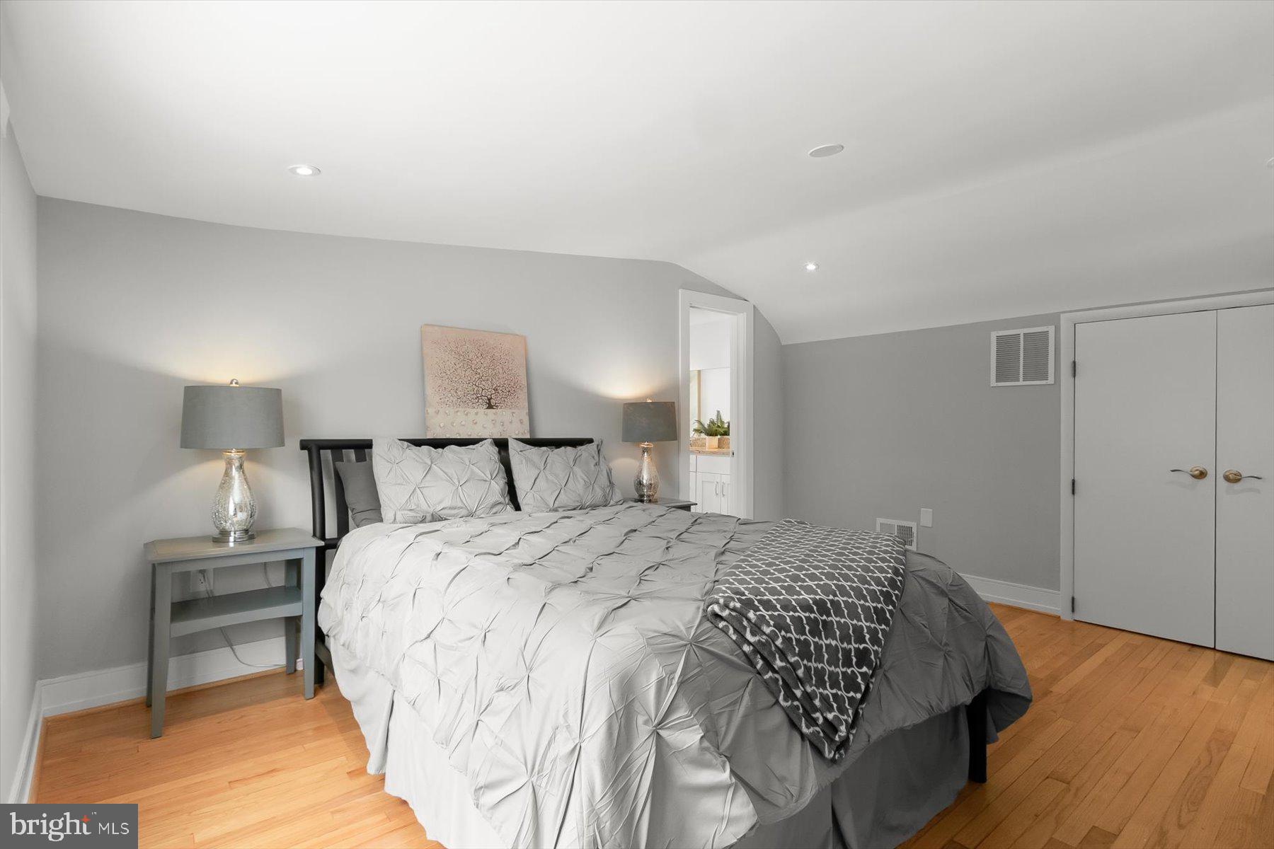 513 Gilmoure Drive Silver Spring, MD 20901 - Photo 38 of 60 a bedroom with a bed and a lamp