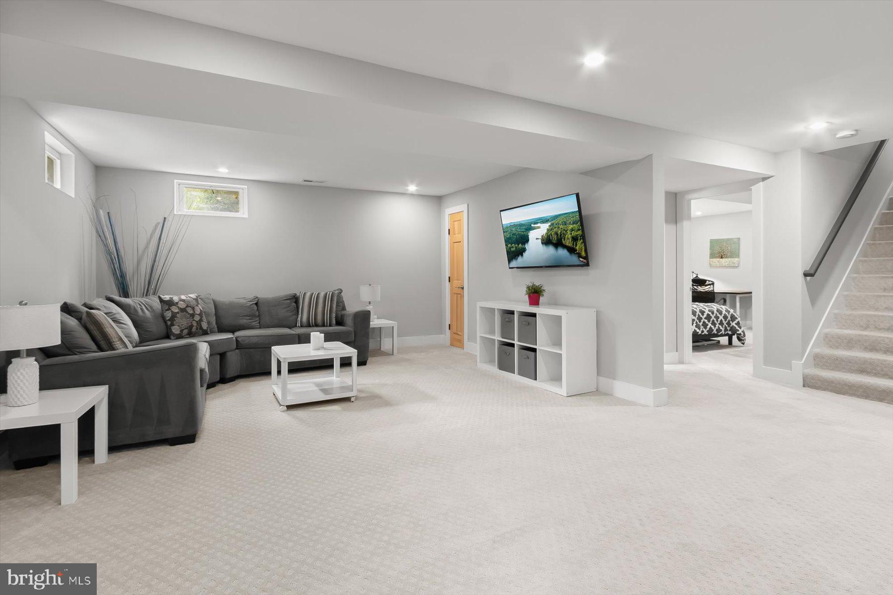 513 Gilmoure Drive Silver Spring, MD 20901 - Photo 42 of 60 a living room with furniture and a flat screen tv