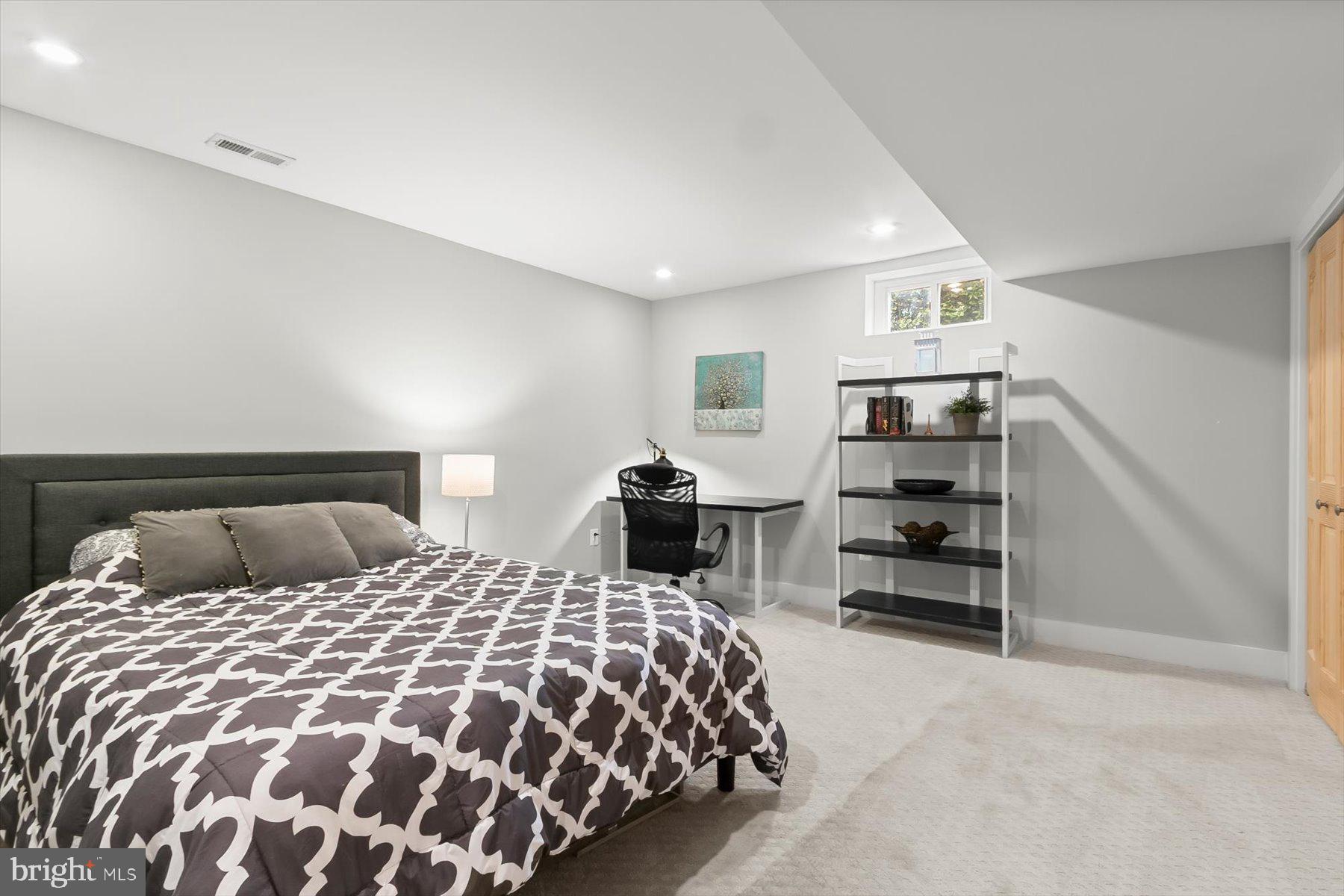 513 Gilmoure Drive Silver Spring, MD 20901 - Photo 50 of 60 a bedroom with a bed and dresser