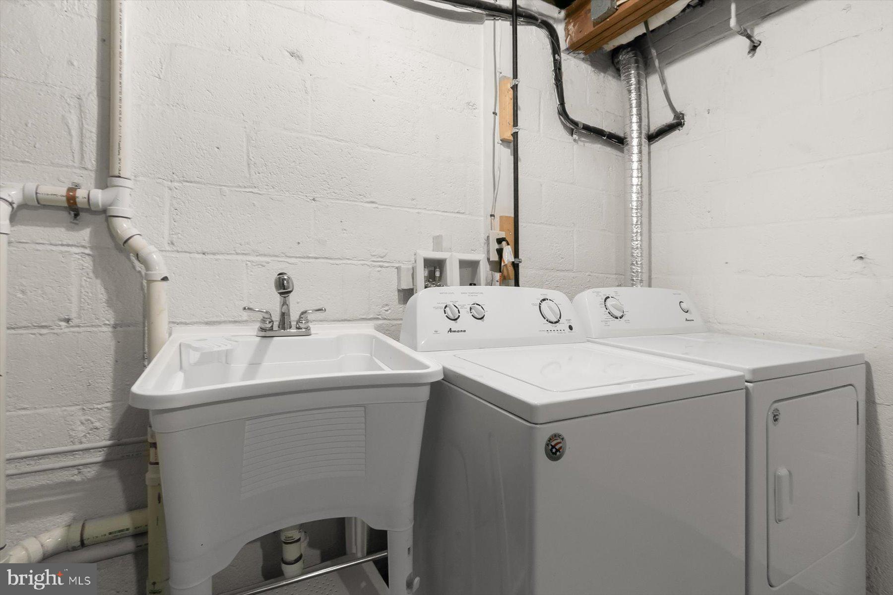 513 Gilmoure Drive Silver Spring, MD 20901 - Photo 52 of 60 a utility room with dryer and washer