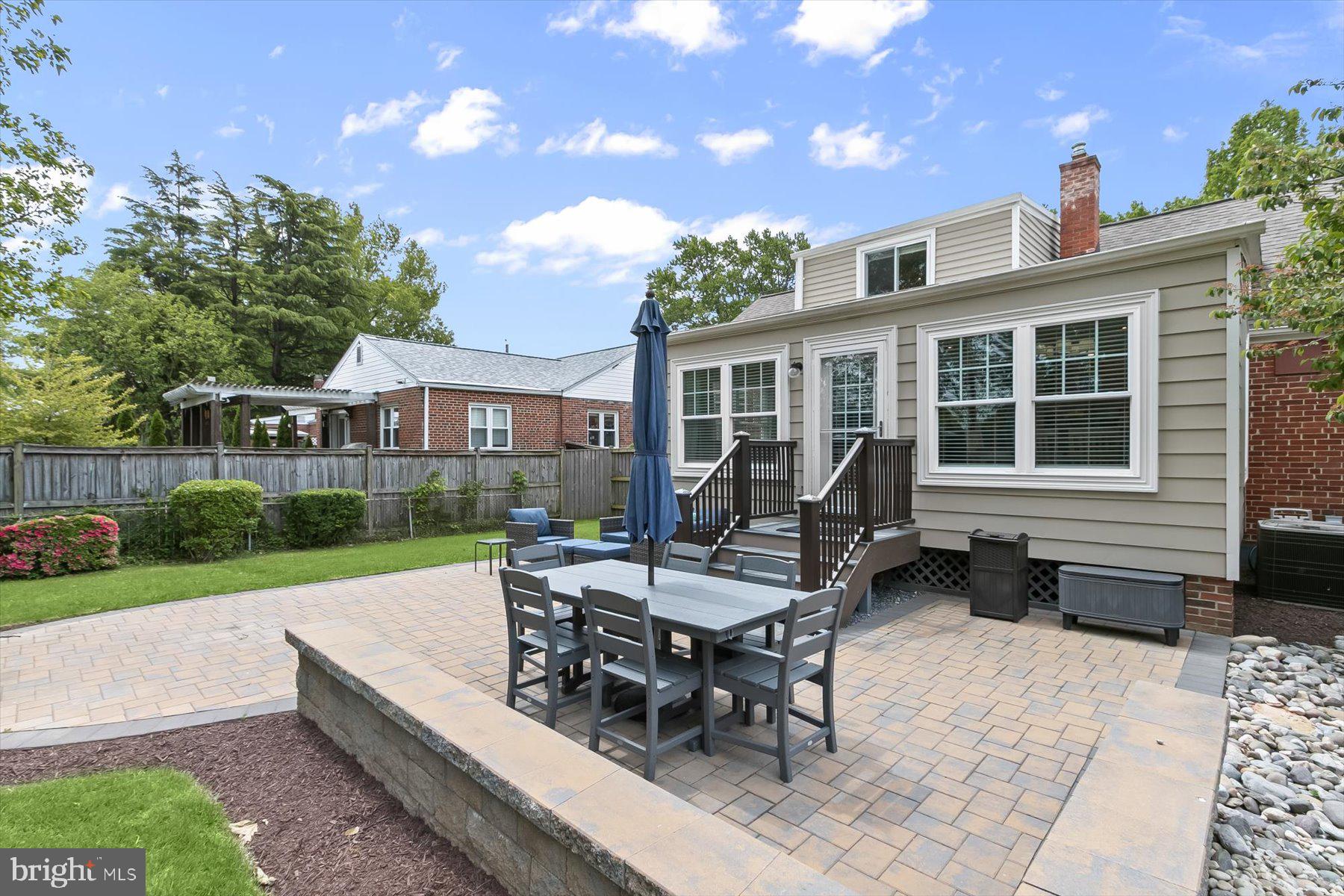 513 Gilmoure Drive Silver Spring, MD 20901 - Photo 54 of 60 a view of a house with backyard sitting area and garden