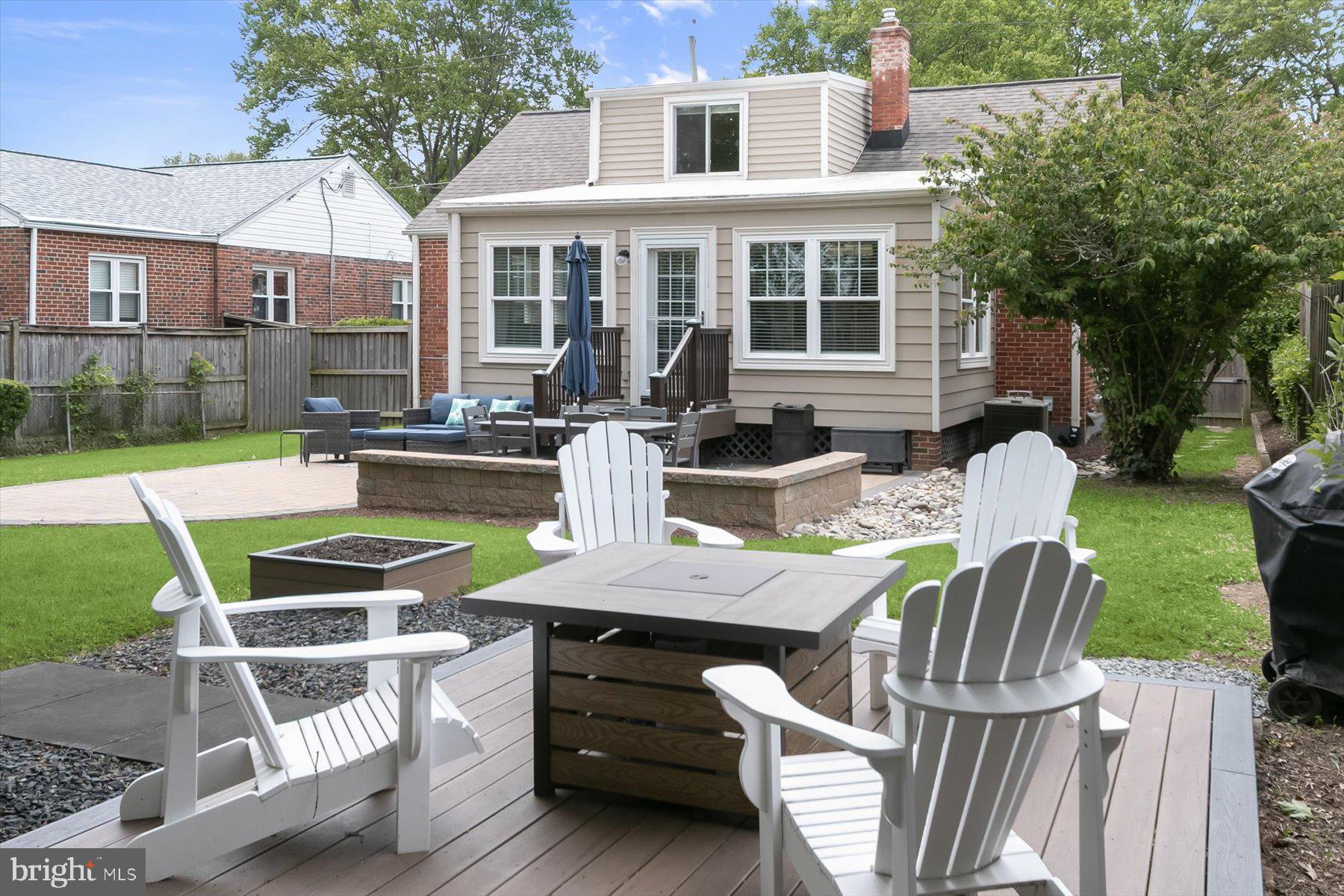 513 Gilmoure Drive Silver Spring, MD 20901 - Photo 59 of 60 a view of a patio with couches chairs and a yard