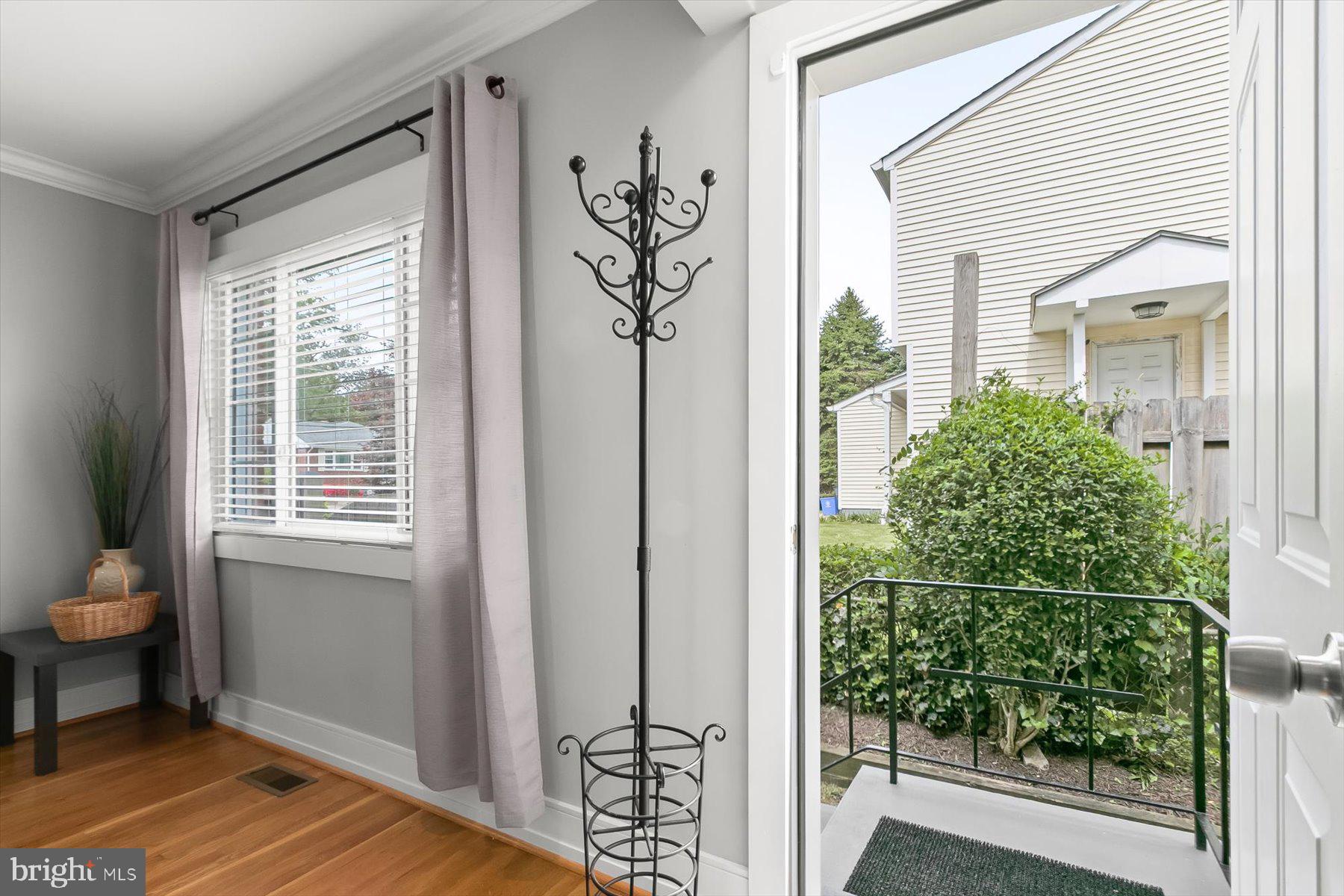 513 Gilmoure Drive Silver Spring, MD 20901 - Photo 6 of 60 a view of a door and chair in the room