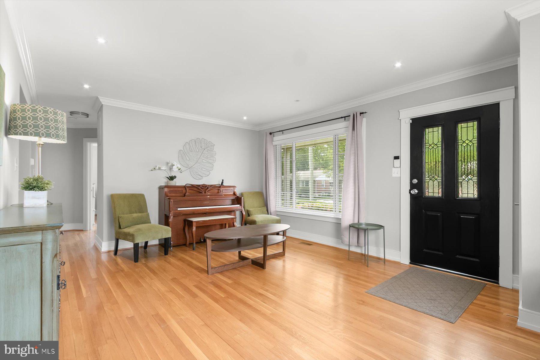 513 Gilmoure Drive Silver Spring, MD 20901 - Photo 7 of 60 a living room with furniture and a wooden floor