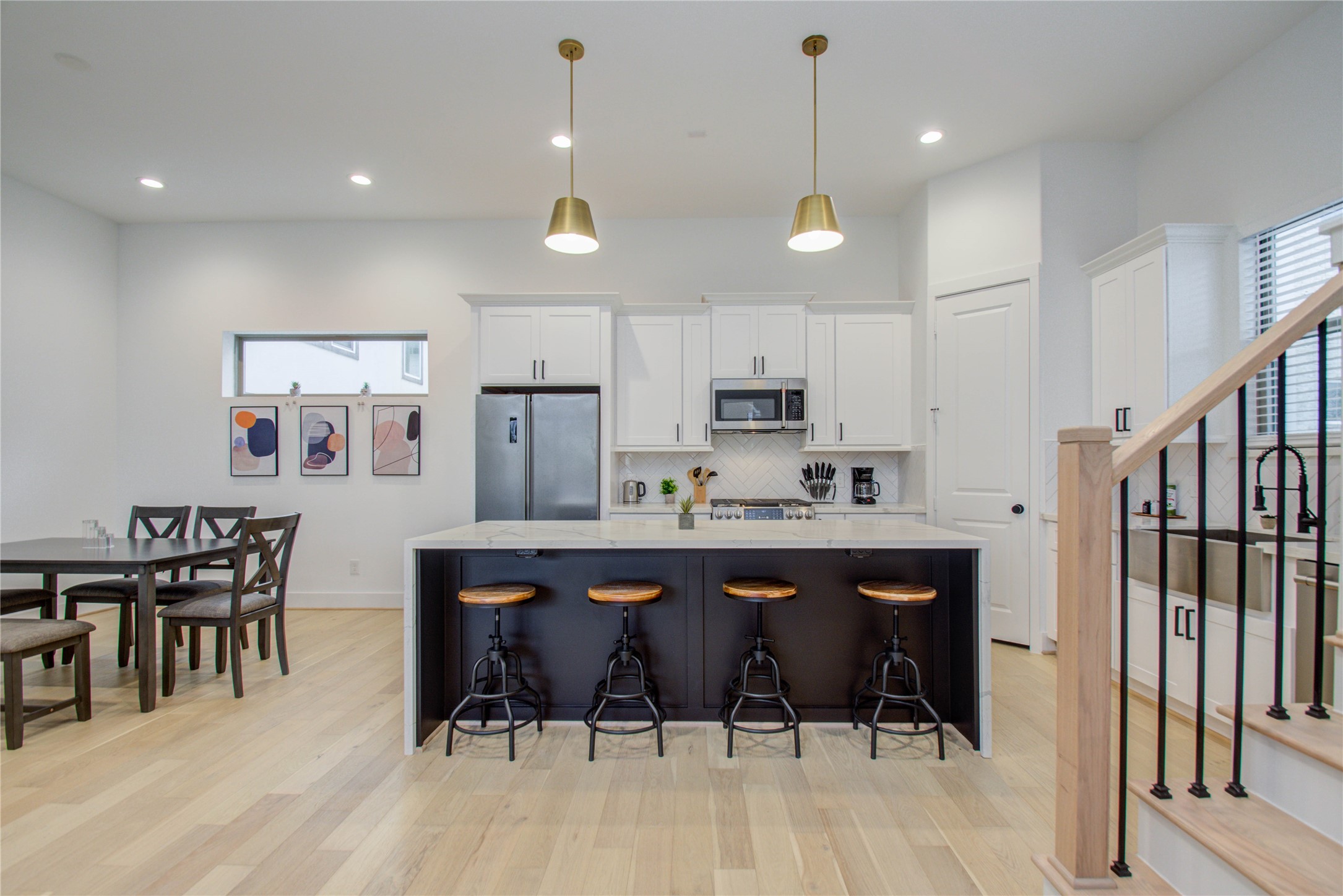 2315 Sherwin Street Houston, TX 77007 - Photo 15 of 50 a large kitchen with a table and chairs in it