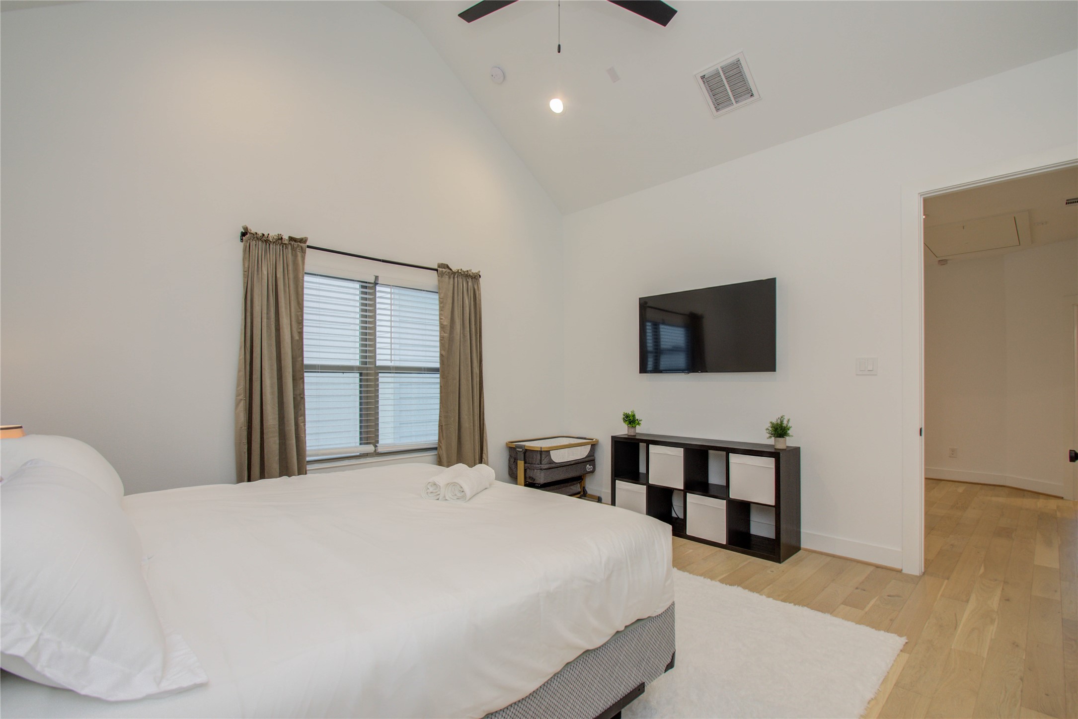 2315 Sherwin Street Houston, TX 77007 - Photo 24 of 50 a bedroom with a bed and wooden floor