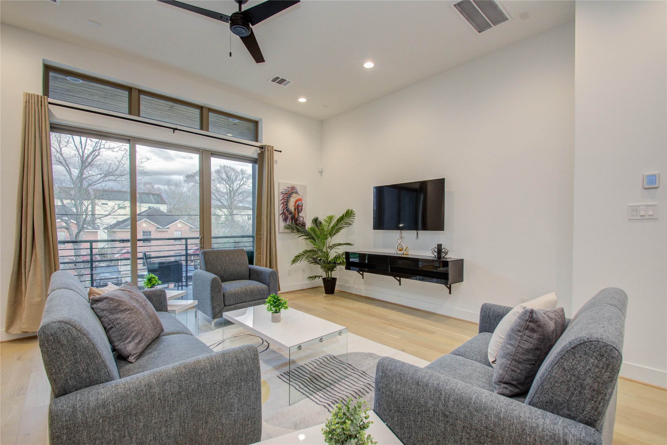 2315 Sherwin Street Houston, TX 77007 - Photo 8 of 50 a living room with furniture a flat screen tv and a large window