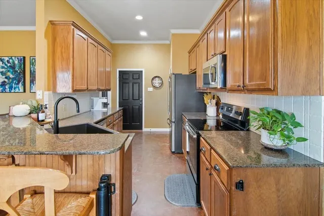 a kitchen with granite countertop a sink and a granite counter tops
