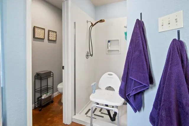 a view of a room with furniture and wooden floor
