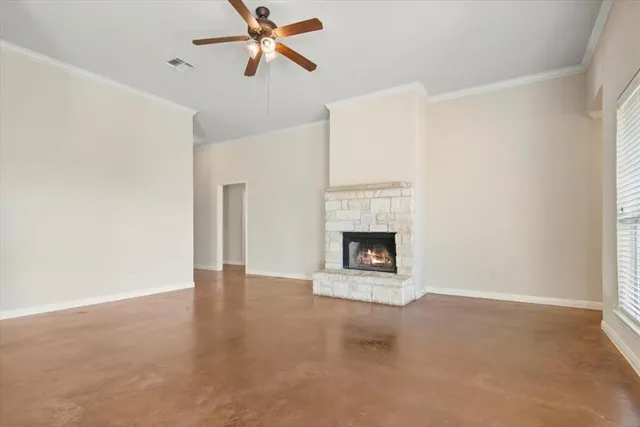 a view of an empty room with a fireplace