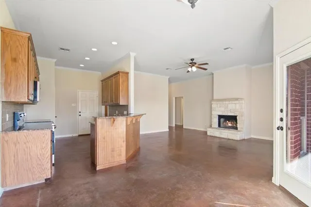 a view of a kitchen with furniture and a fireplace