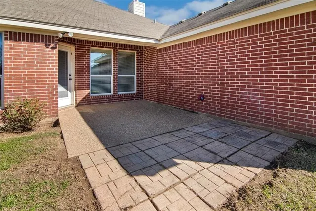 a view of house with backyard