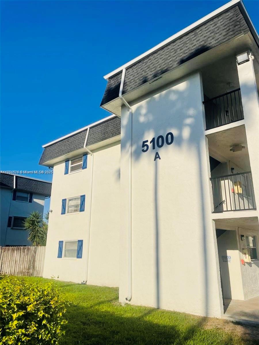 5100 Southwest 64th Avenue, Unit 101 Davie, FL 33314 - Photo 2 of 17 a view of a house with a yard