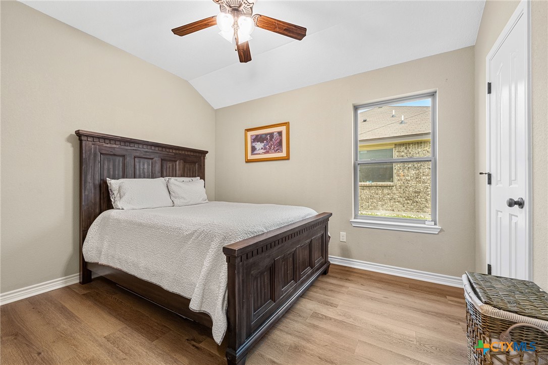3409 Plains Street Copperas Cove, TX 76522 - Photo 22 of 33 a bed sitting in a bedroom next to a window