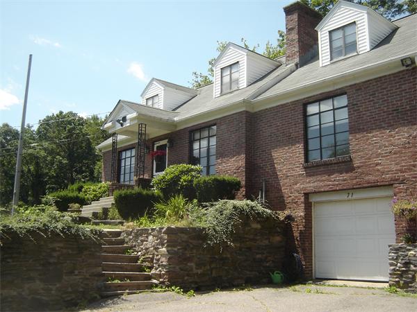 71 Southampton Road Holyoke, MA 01040 - Photo 4 of 12 a front view of a house with garden