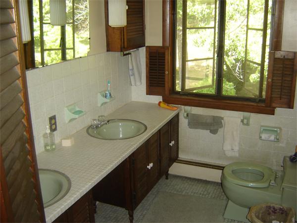 71 Southampton Road Holyoke, MA 01040 - Photo 10 of 12 a bathroom with a sink toilet and a window