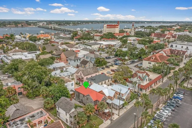 an aerial view of residential houses with outdoor space