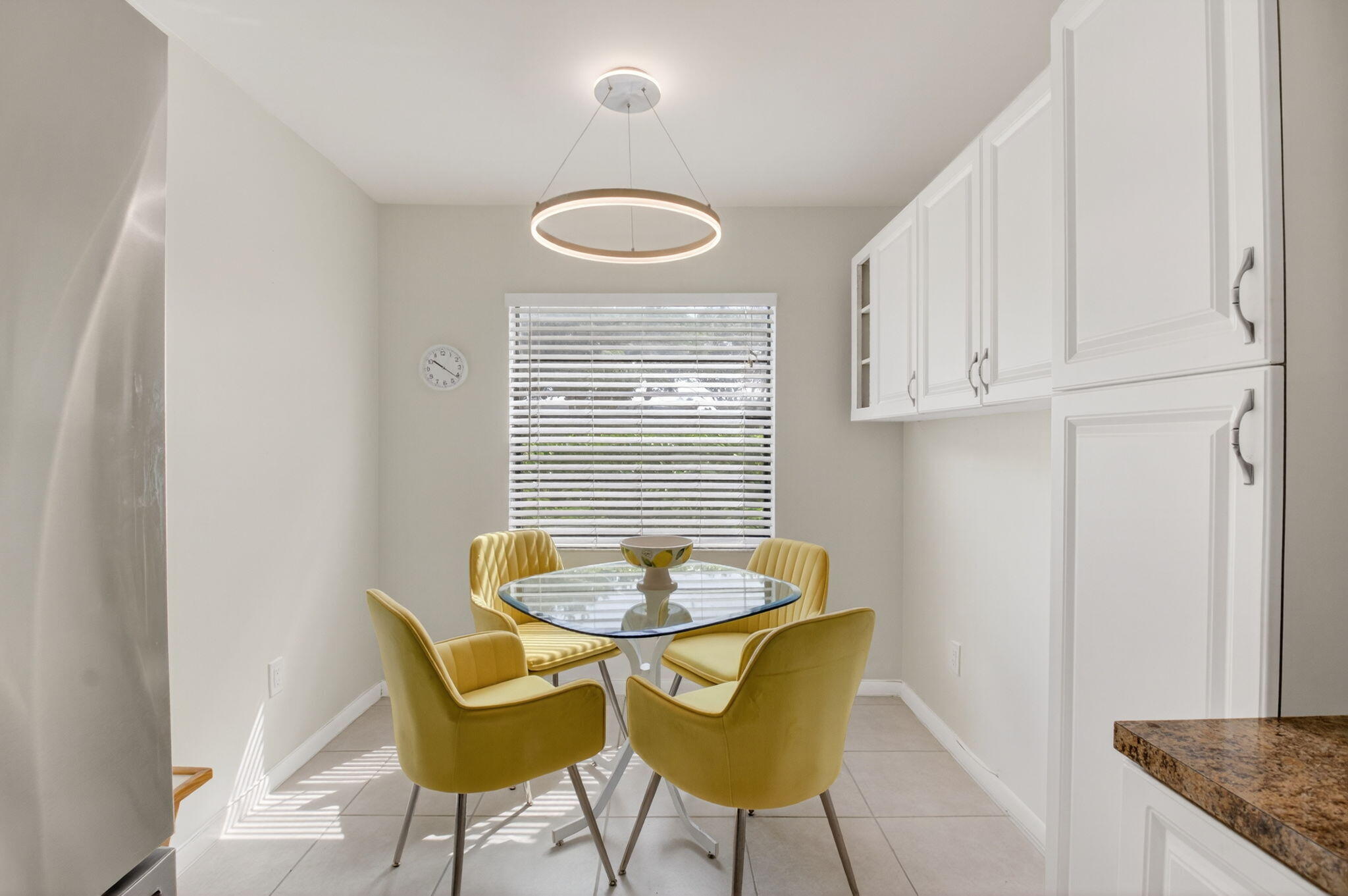 10 Southport Lane, Unit E Boynton Beach, FL 33436 - Photo 14 of 47 a view of a dining room with furniture and wooden floor