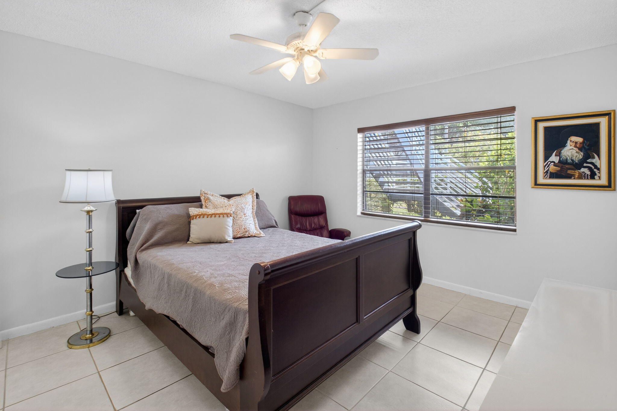10 Southport Lane, Unit E Boynton Beach, FL 33436 - Photo 28 of 47 a bedroom with a bed and a window