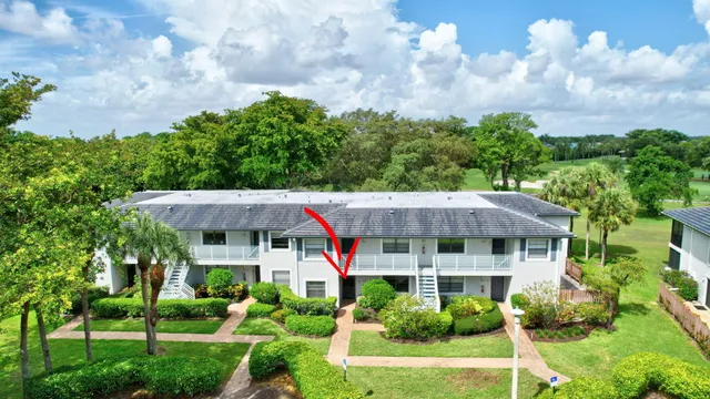 a view of a house with garden and yard