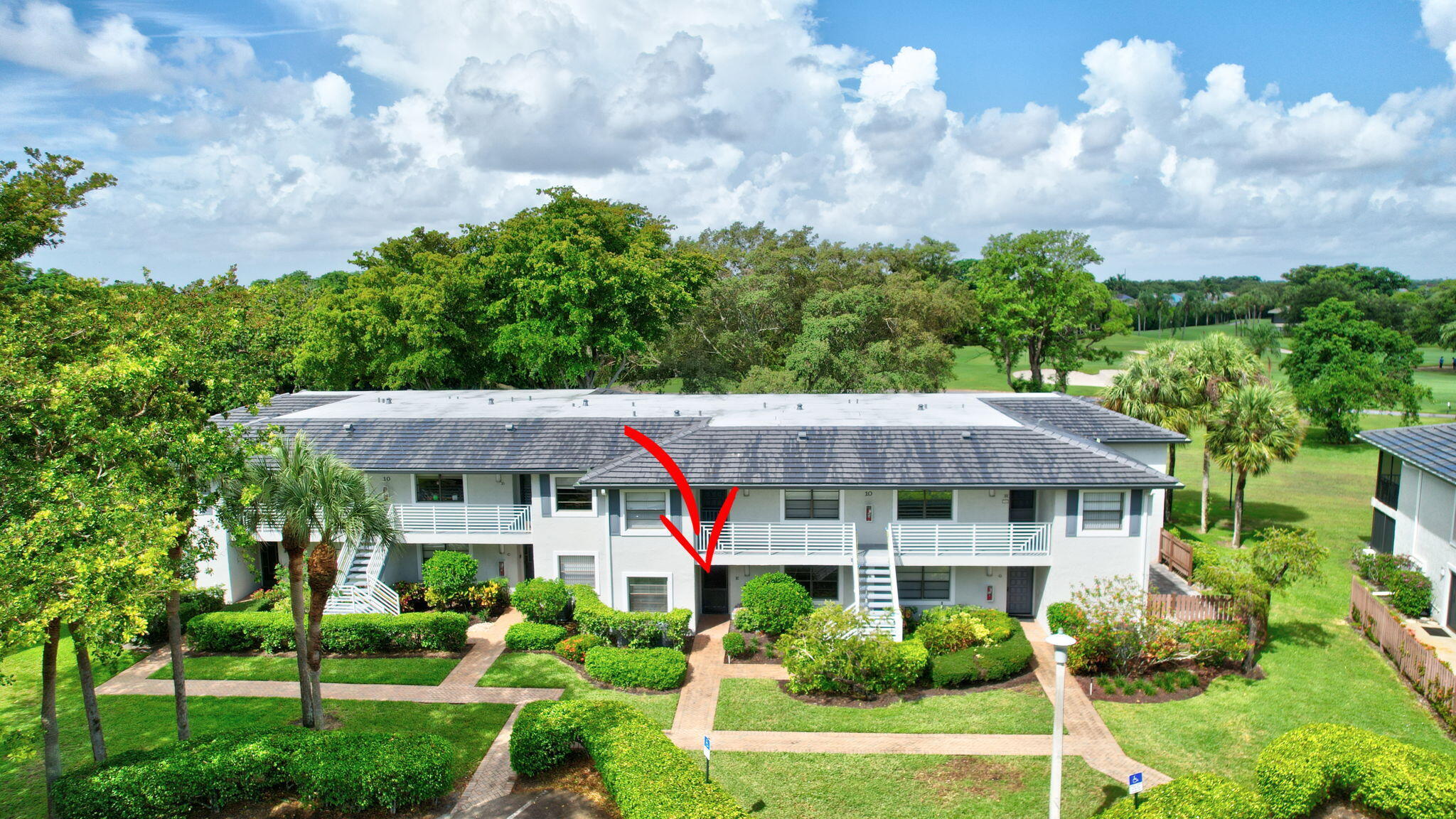 10 Southport Lane, Unit E Boynton Beach, FL 33436 - Photo 33 of 47 a view of a house with garden and yard