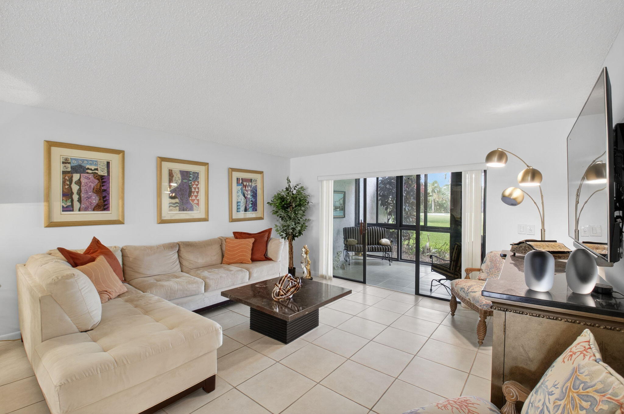 10 Southport Lane, Unit E Boynton Beach, FL 33436 - Photo 7 of 47 a living room with furniture and floor to ceiling window