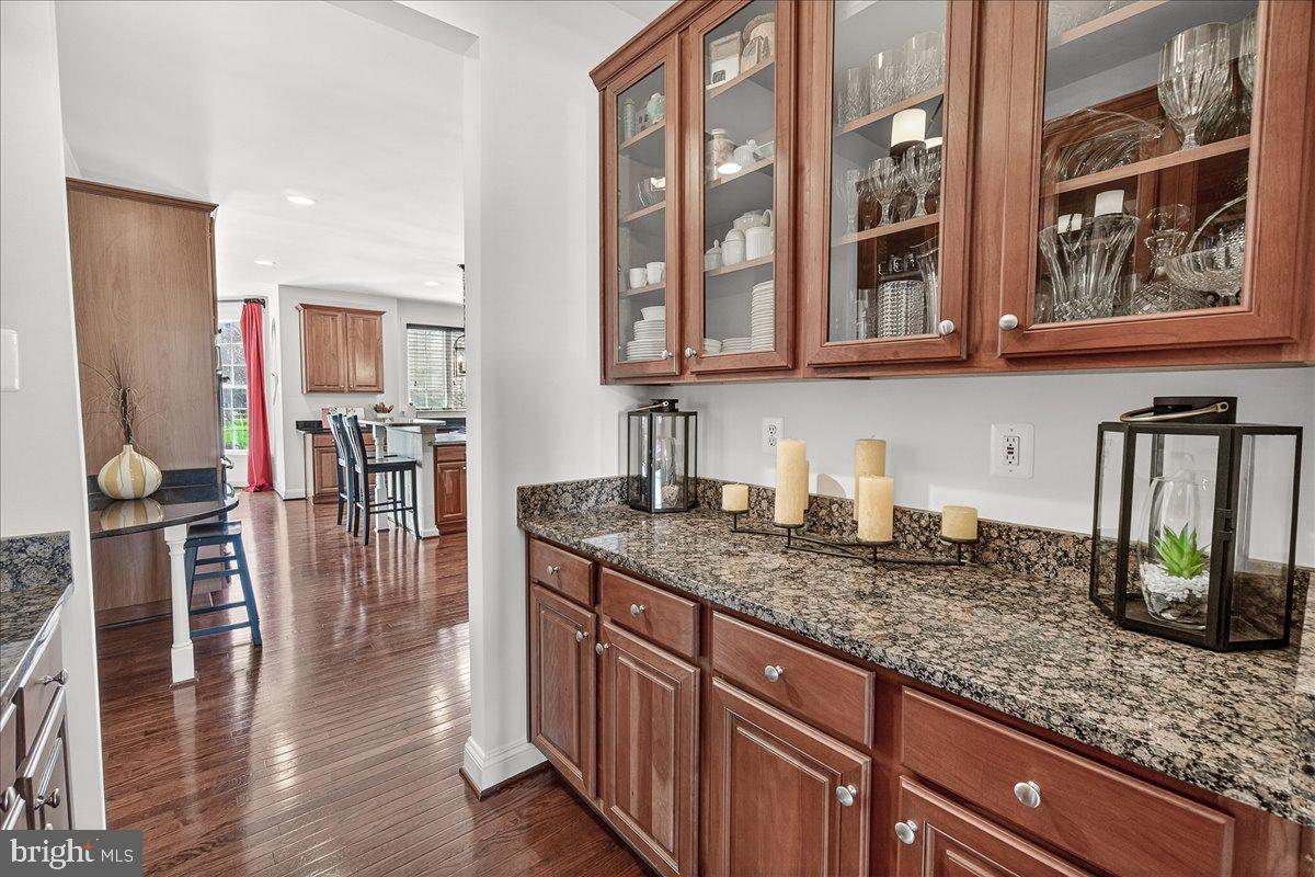 411 William Plummer Street New Market, MD 21774 - Photo 11 of 89 a kitchen with stainless steel appliances granite countertop a sink dishwasher and cabinets with wooden floor