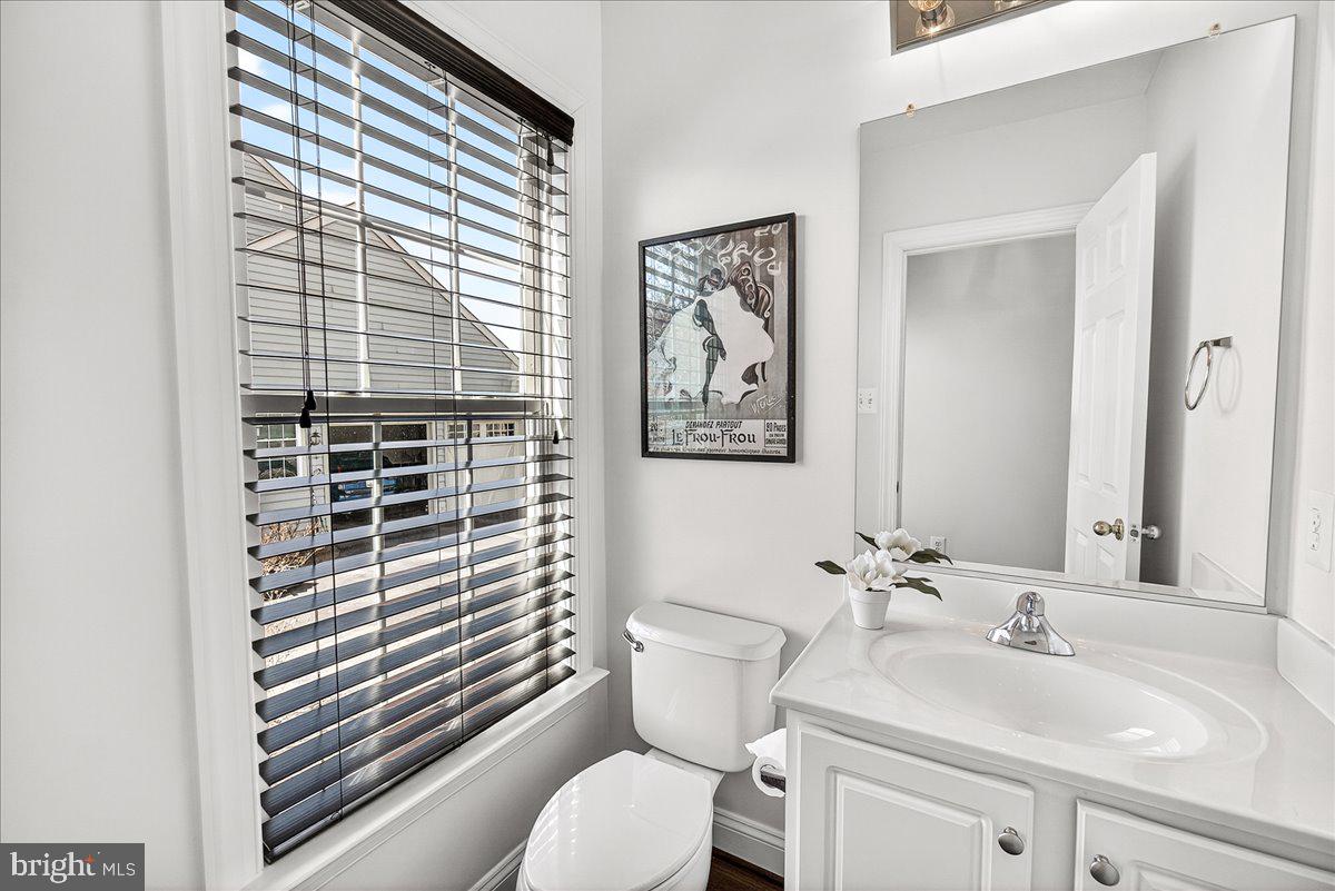 411 William Plummer Street New Market, MD 21774 - Photo 17 of 89 a bathroom with a sink a toilet and a mirror