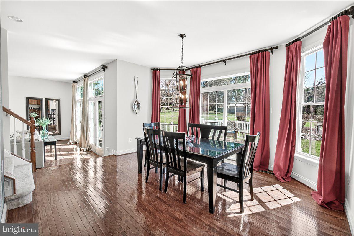 411 William Plummer Street New Market, MD 21774 - Photo 25 of 89 a view of a dining room with furniture window and wooden floor