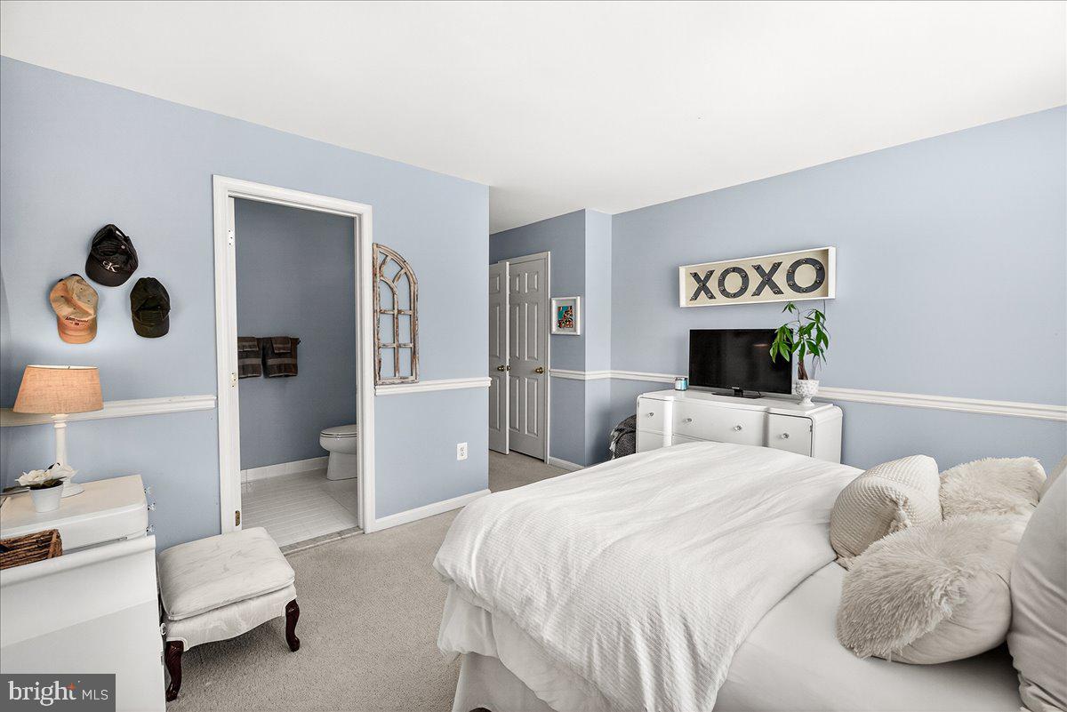 411 William Plummer Street New Market, MD 21774 - Photo 43 of 89 a bedroom with a bed and a couch