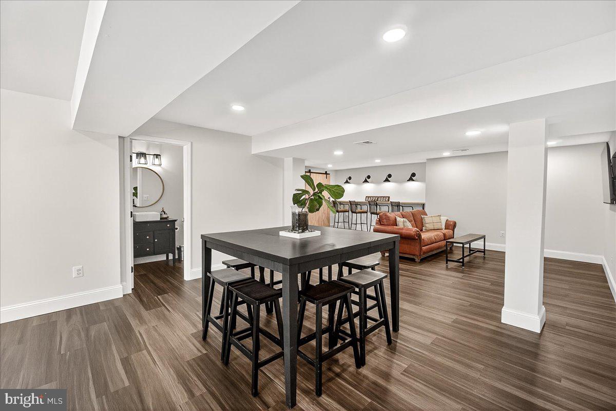 411 William Plummer Street New Market, MD 21774 - Photo 59 of 89 a view of a dining room with furniture and wooden floor
