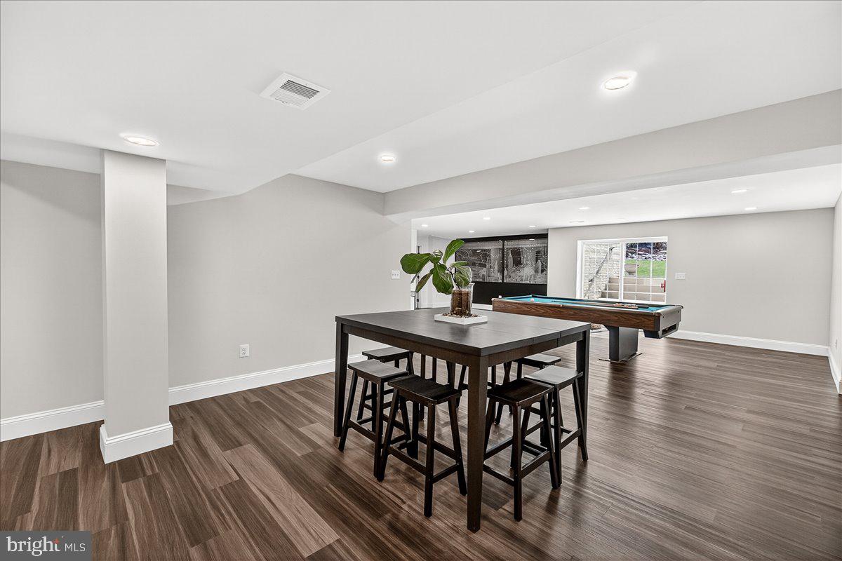411 William Plummer Street New Market, MD 21774 - Photo 60 of 89 a view of a dining room with furniture and wooden floor